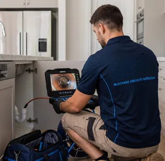 Clearing a blocked sink at a Bankstown property